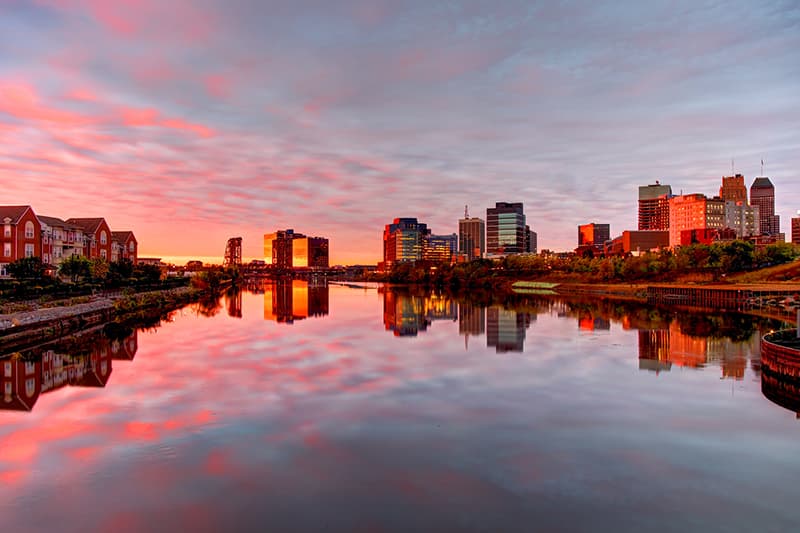 Sunset view of the Newark, New Jersey skyline reflected in the Passaic River