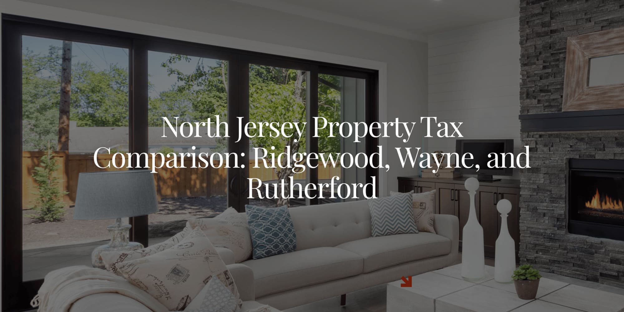 A bright living room with a stone fireplace and large windows, with the text: North Jersey Property Tax Comparison: Ridgewood, Wayne, and Rutherford